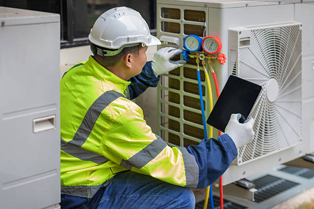 Professional Hvac technician working in Magnolia Springs, AL